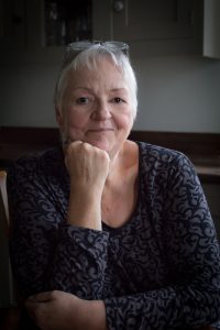 Low key image of a beautiful mature lady